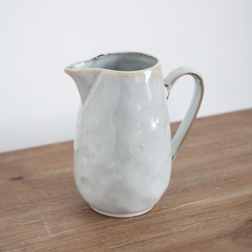 Glazed ceramic jug.