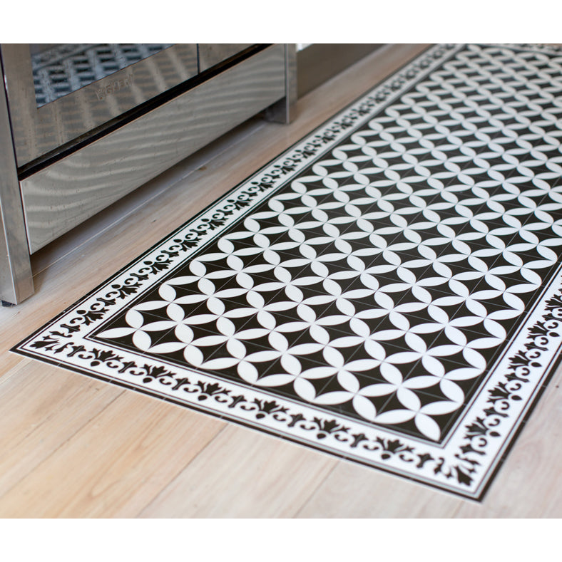 black and white vinyl floor mat in kitchen.