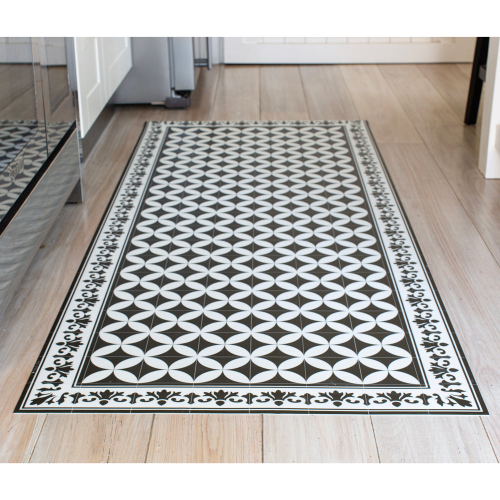 black and white vinyl floor mat in kitchen.