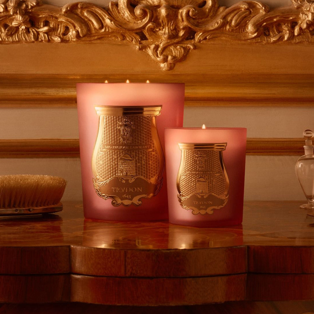 Trudon Tuileries Intermezzo candle with a classic candle.