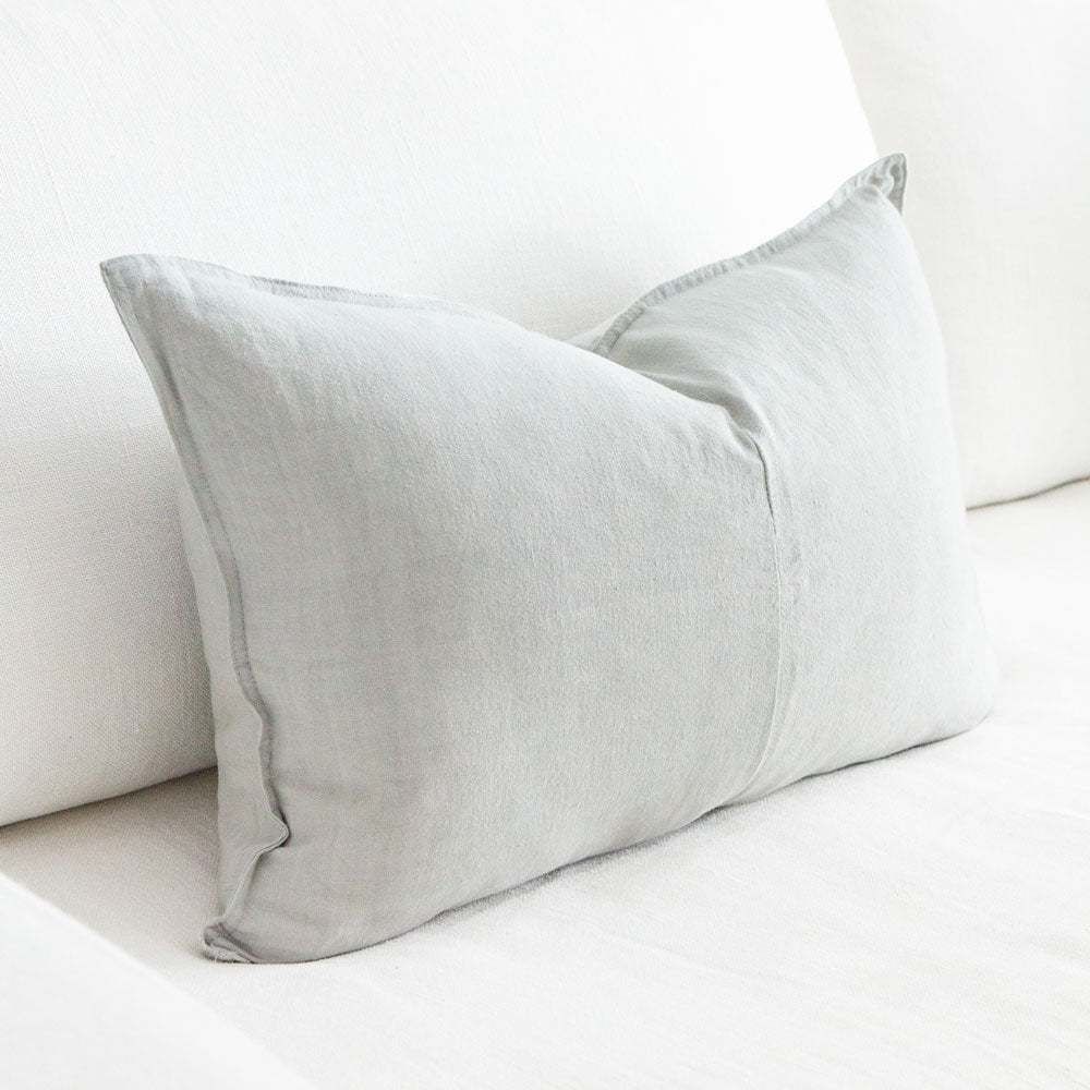 Rectangular light grey linen cushion.