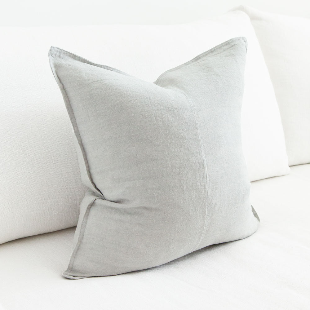 Light grey square linen cushion.