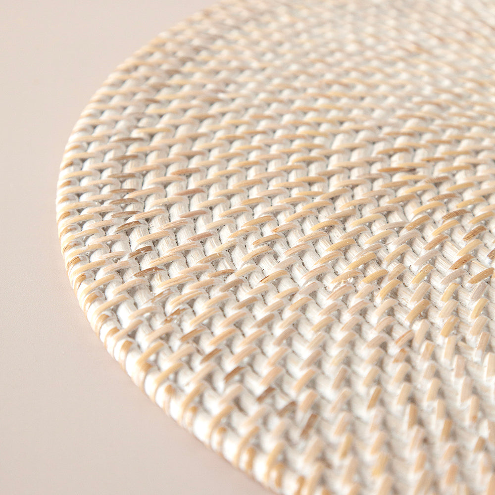 Close up of whitewash rattan placemat.