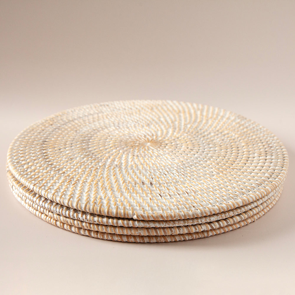 Stack of whitewash rattan placemats.
