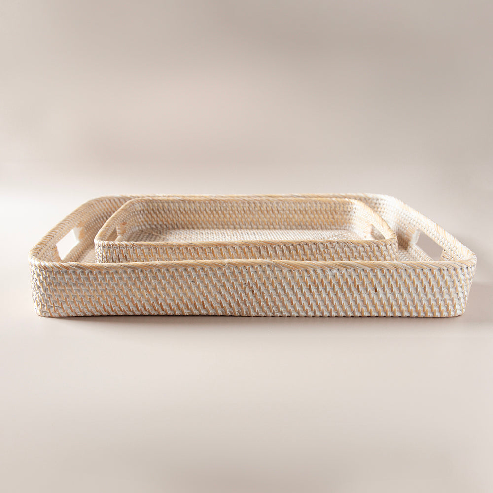 Whitewash rectangular rattan tray in two sizes.