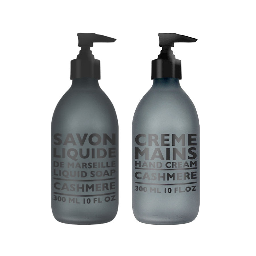 Copmagnie De Provence cashmere soap and hand cream in matte black glass bottles with pump tops.
