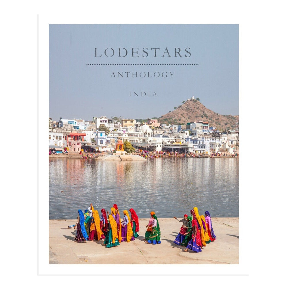 Lodestars Anthology India Magazine cover featuring colourfully dressed Indian woman walking along a waterway with buildings in the background.