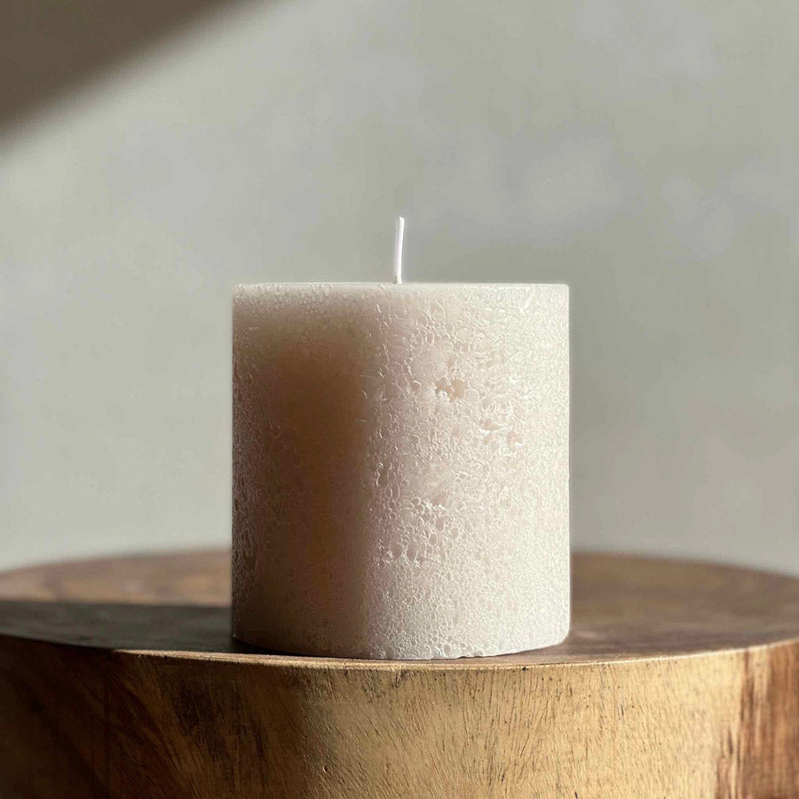 Small textured pillar candle sandstone.