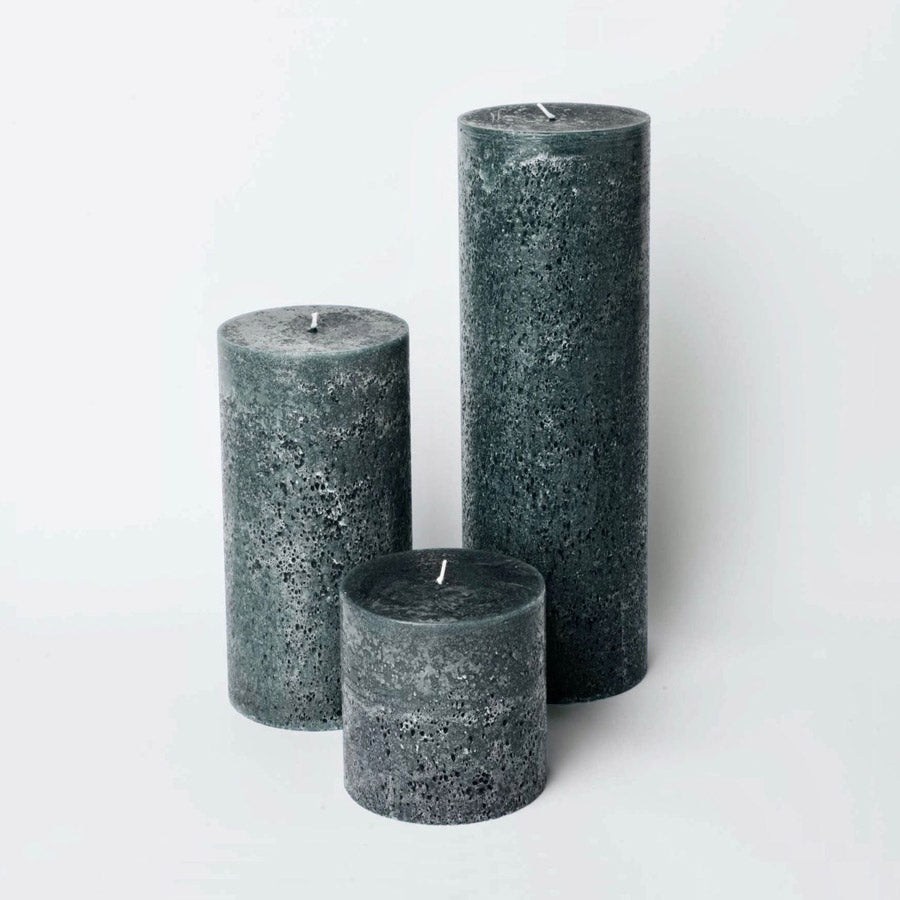 Trio of textured pillar candles in charcoal.