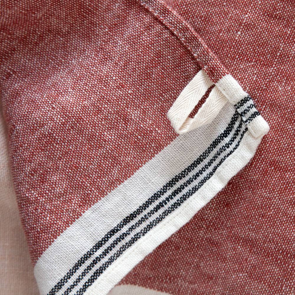 Hanging loop on red tea towel.