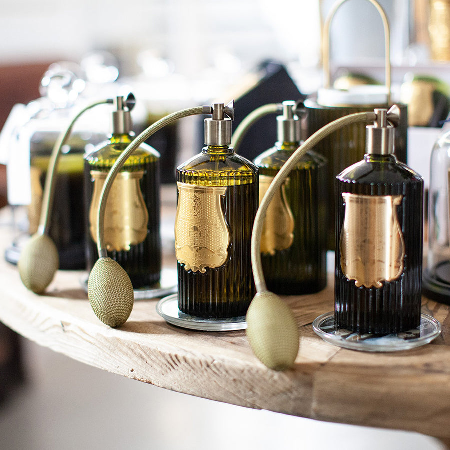 A selection of Trudon Room Sprays displayed on a table.