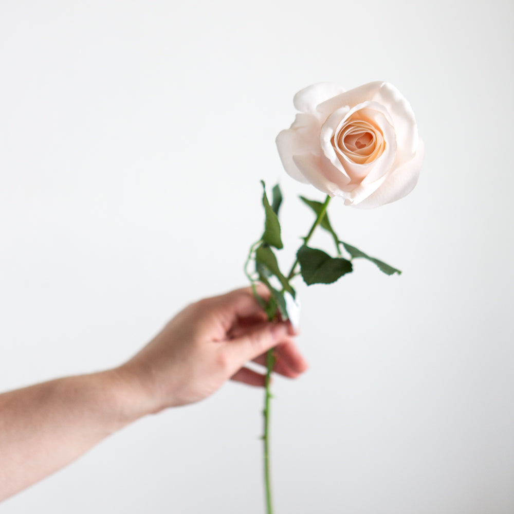 Artificial Single stem soft pink rose.