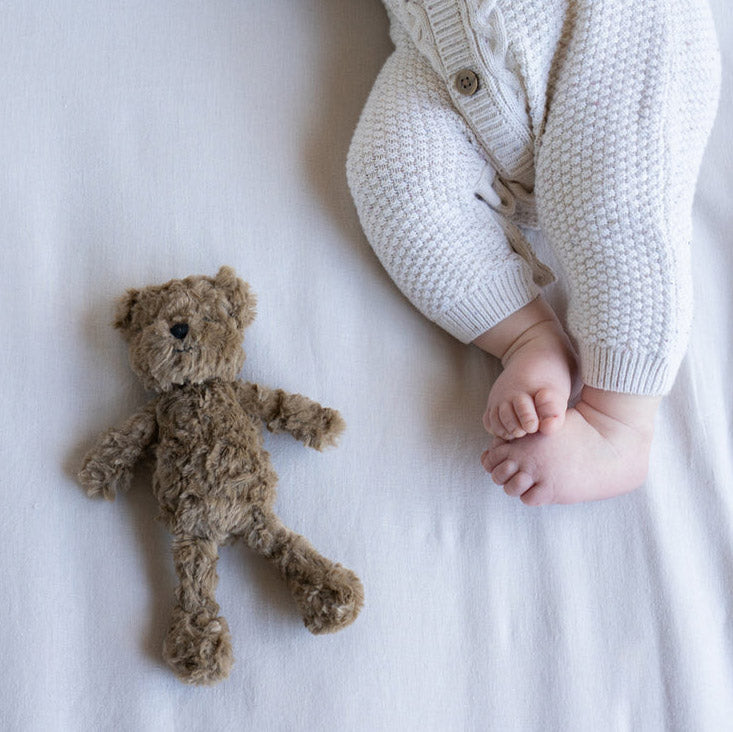 Benny the brown teddy bear rattle with baby.