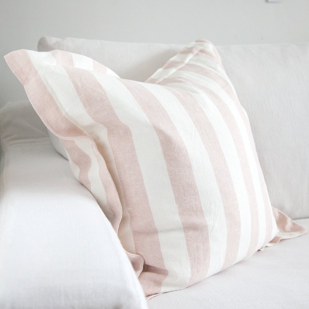 Blush pink and white stripe cushion. 