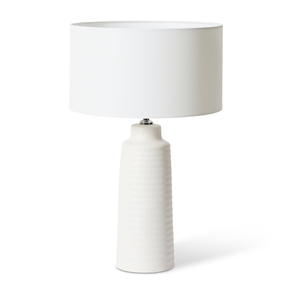 Cassie table lamp features a tall textured ceramic base and linen shade.