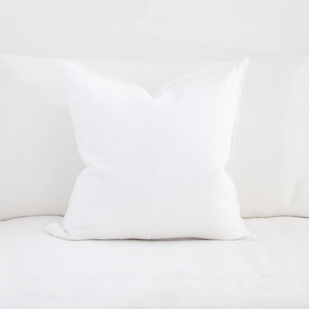 Square white linen cushion.