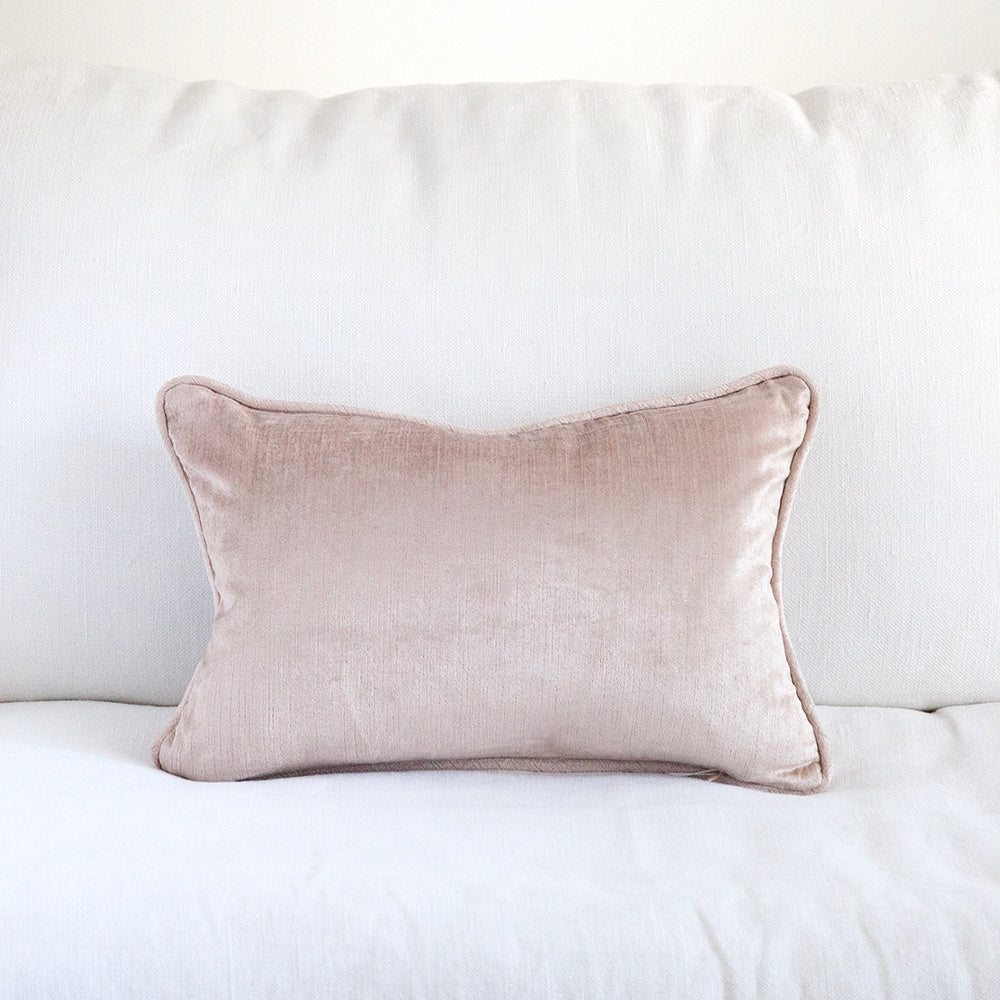Dusty Pink Velvet Cushion on white sofa.