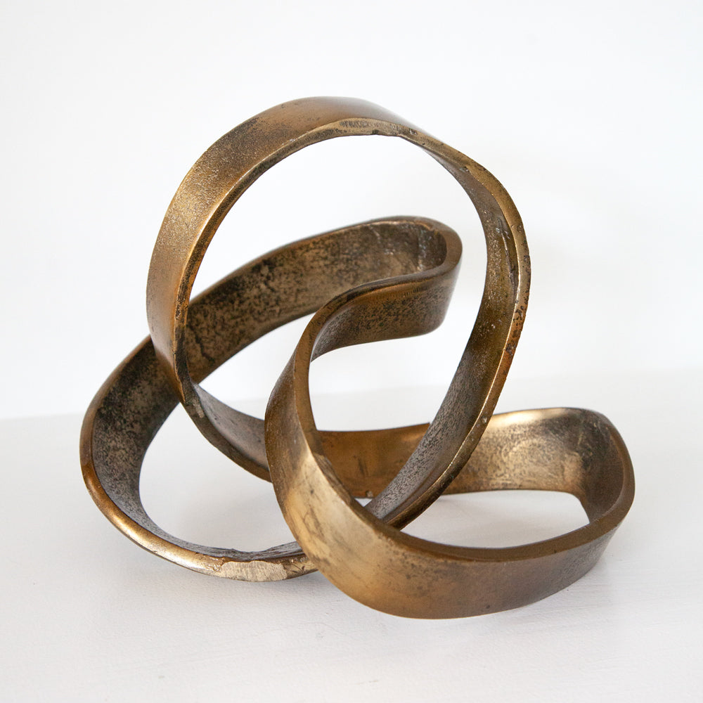 Freeform brass sculpture suited to styling a shelf, coffee table or console.