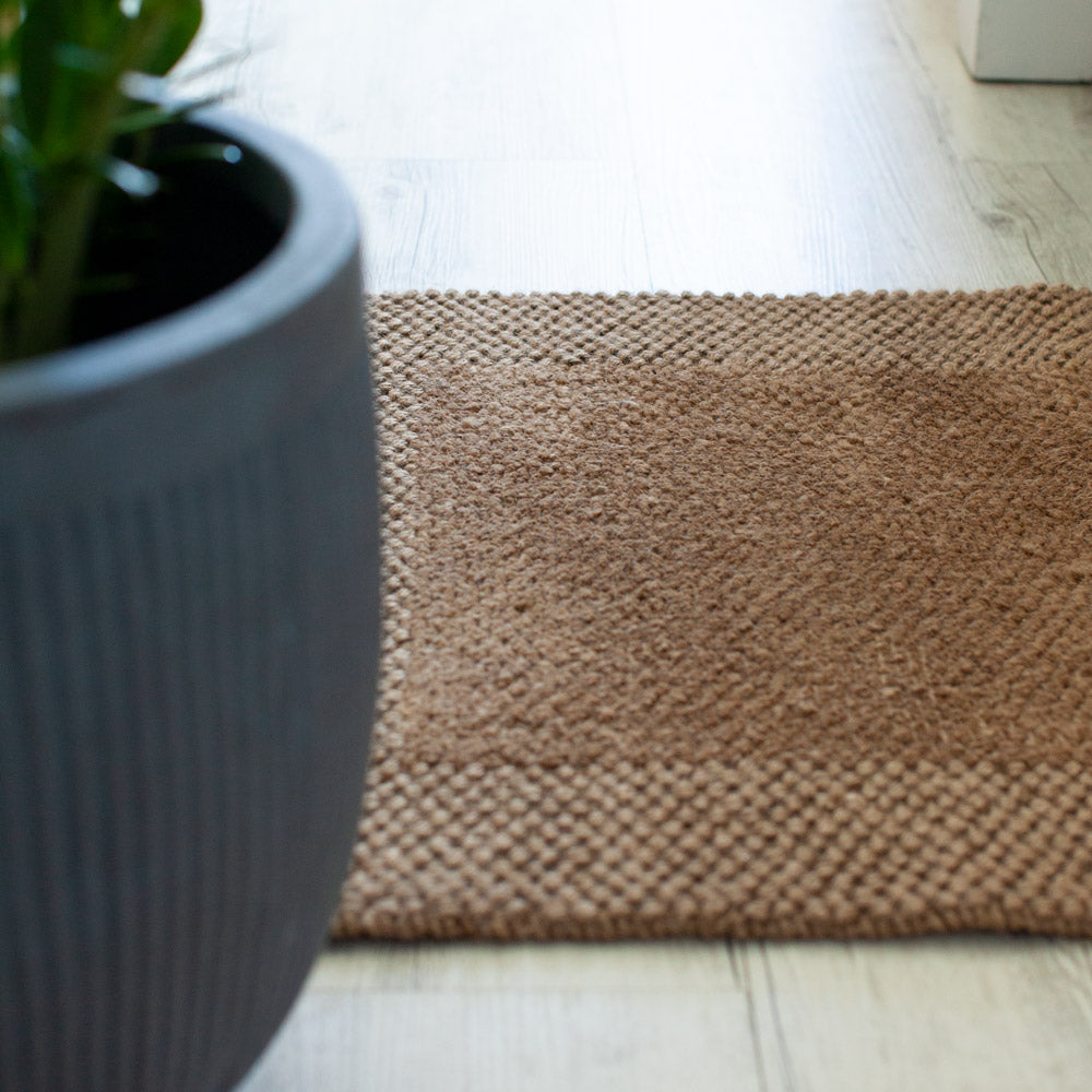 Jute door mat with latex backing.