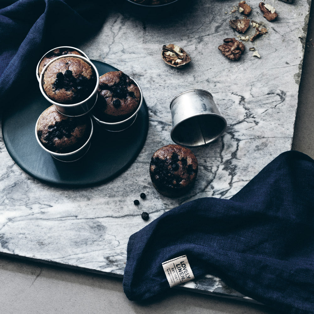 dark blue napkins with some freshly baked muffins