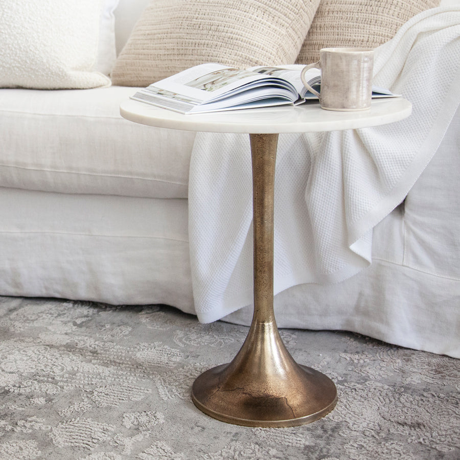 Round marble top side table with brass coloured base.