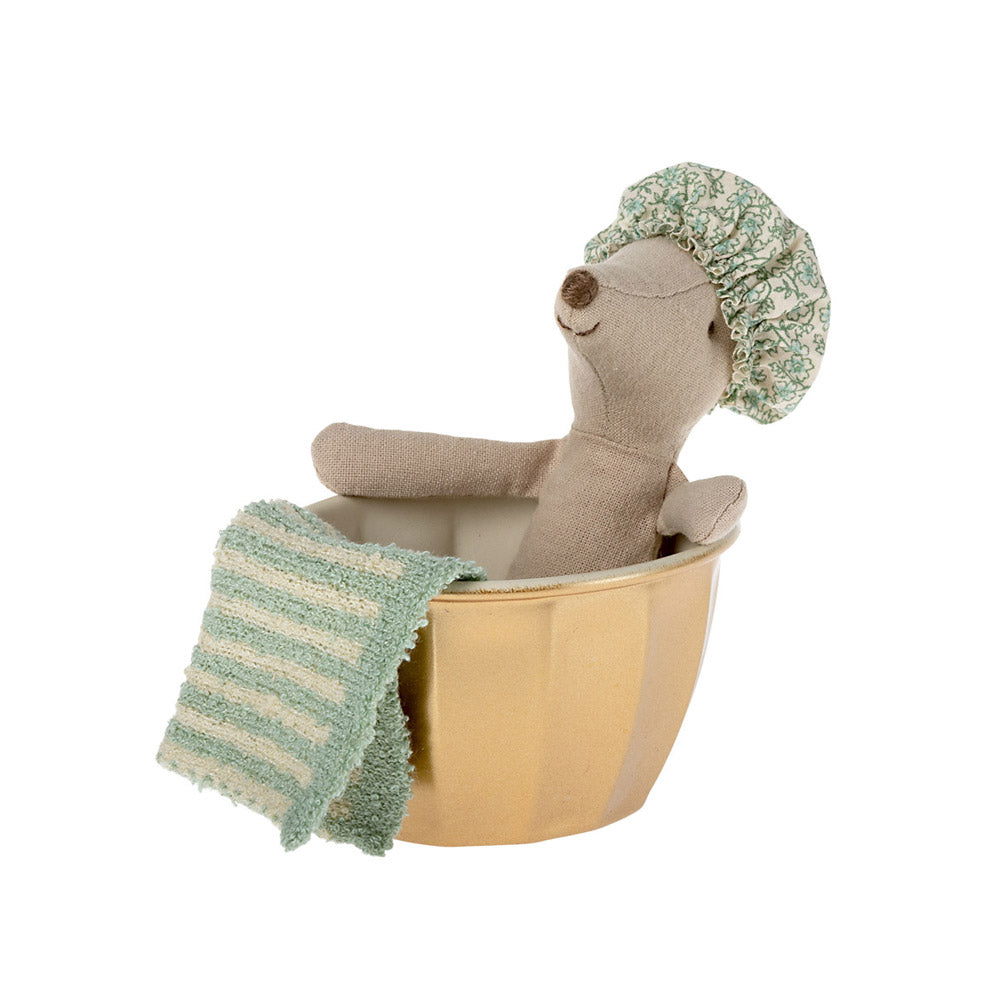 Maileg big sister mouse in gold bath tub with towel and shower cap.