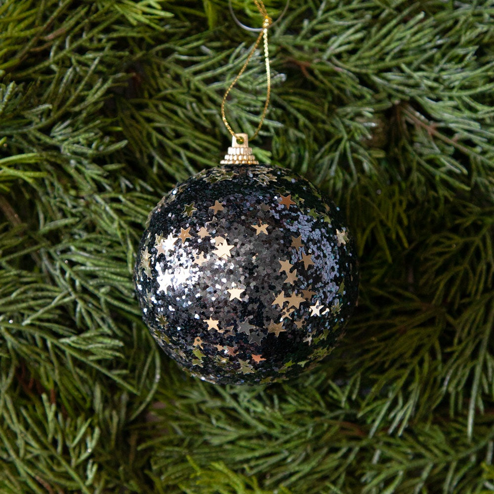 Midnight blue glitter bauble with gold stars. 
