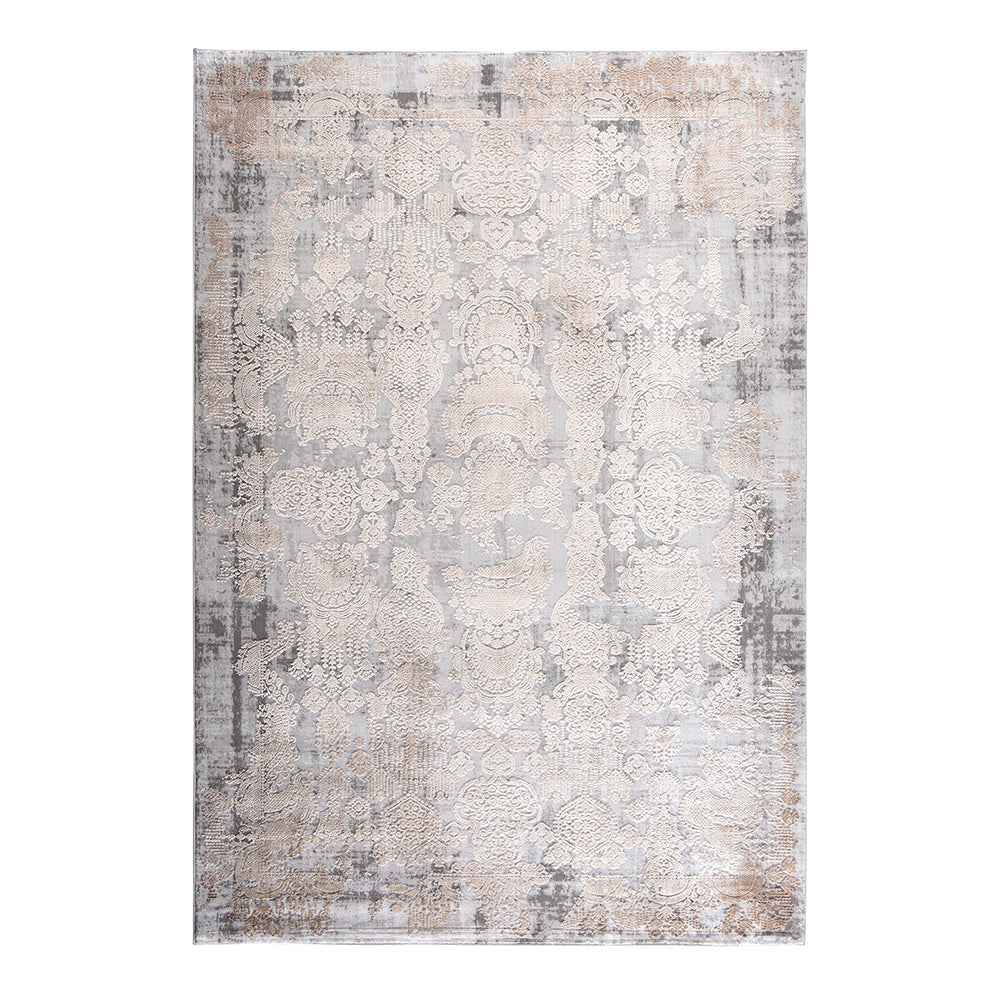 Millie floor rug featuring a mottled grey background and soft warn print.