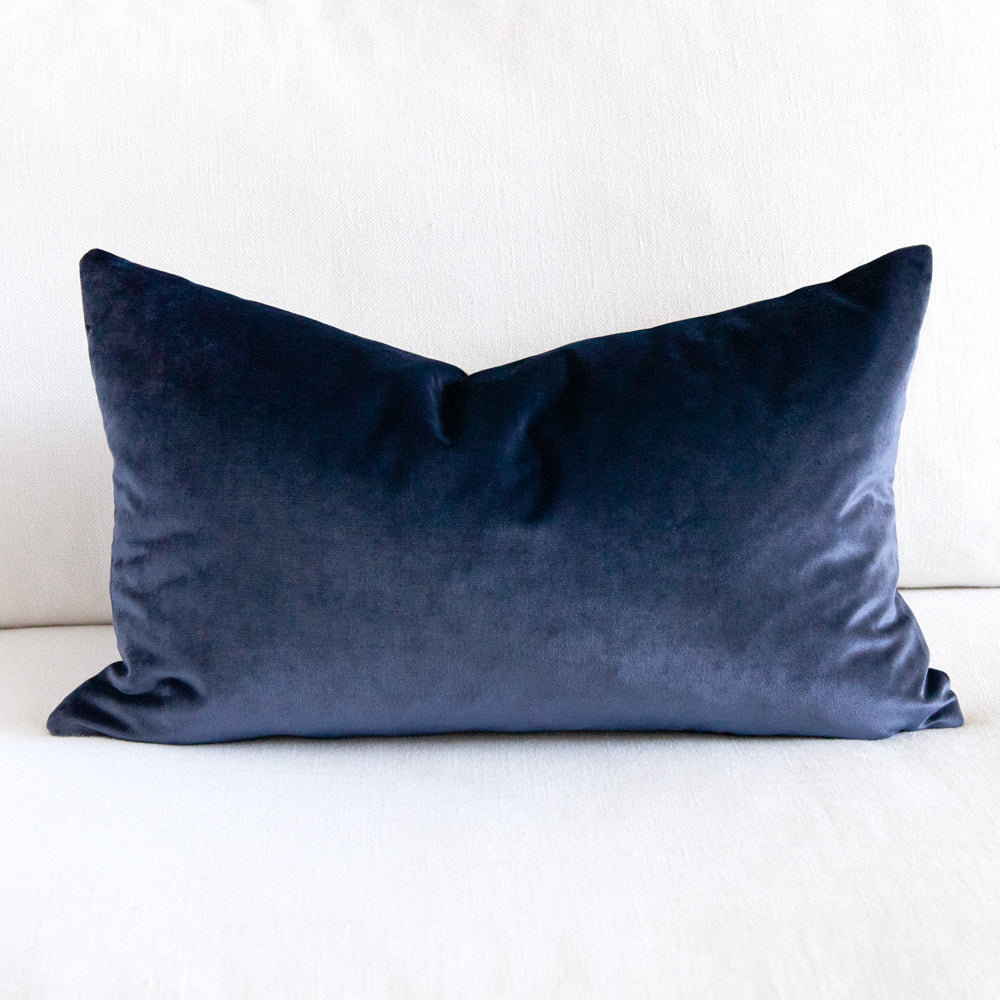 Rectangular blue velvet cushion.
