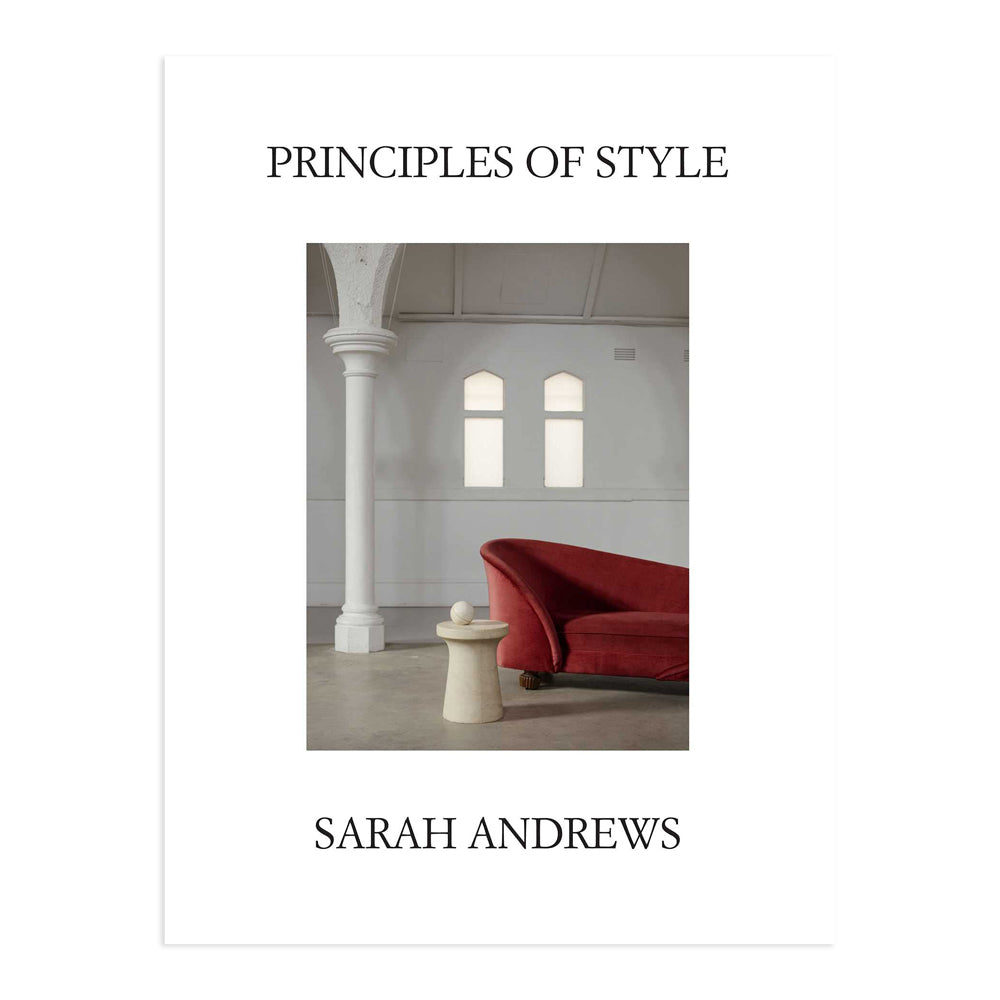 Principles of Style by Sarah Andrews. Cover is white featuring a photograph of a red velvet sofa in white church like space. 