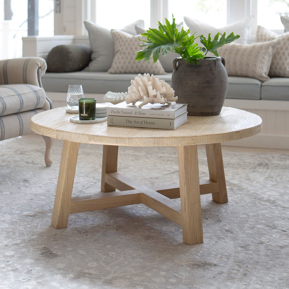 Round coffee table made from recycled elm wood.