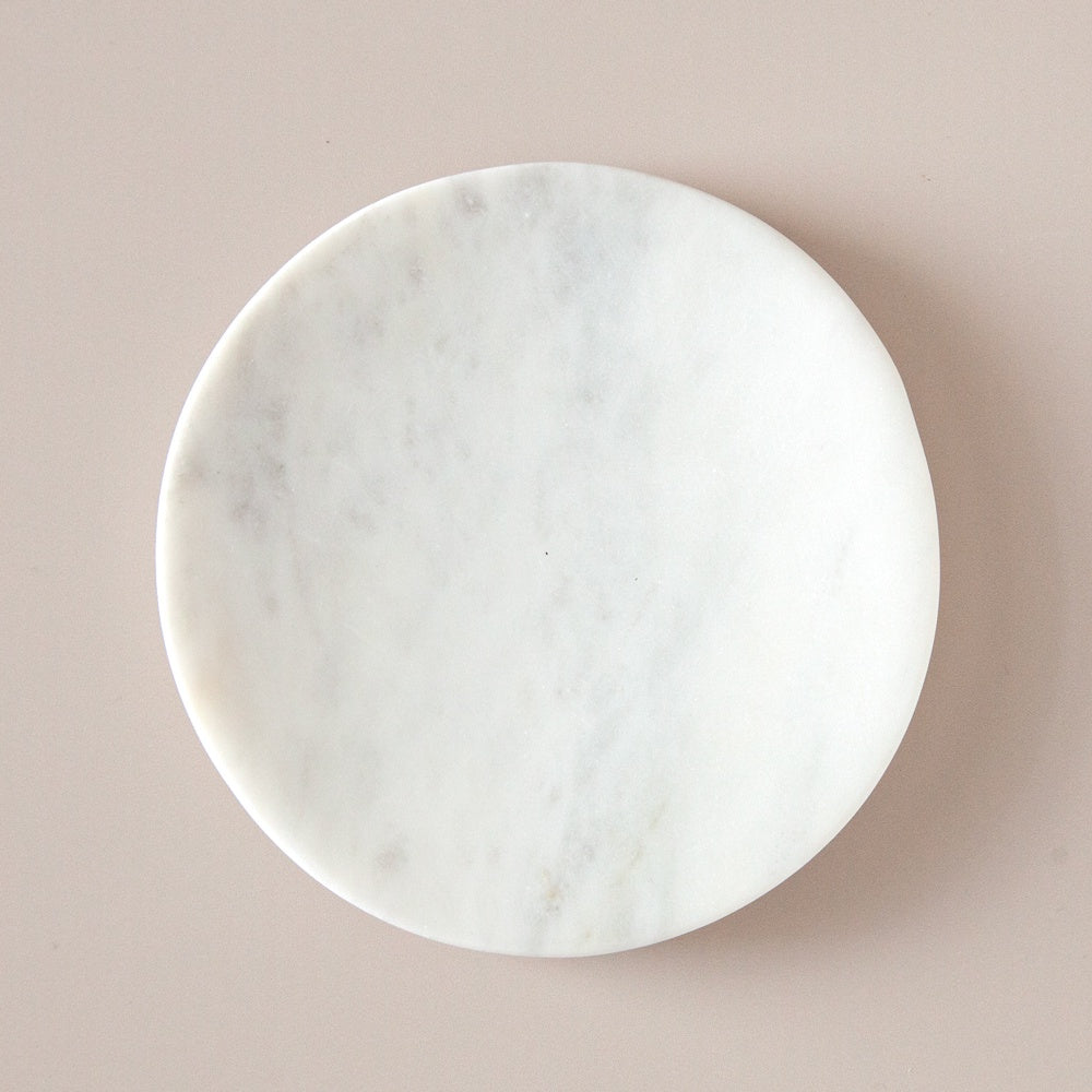 Round marble soap dish.