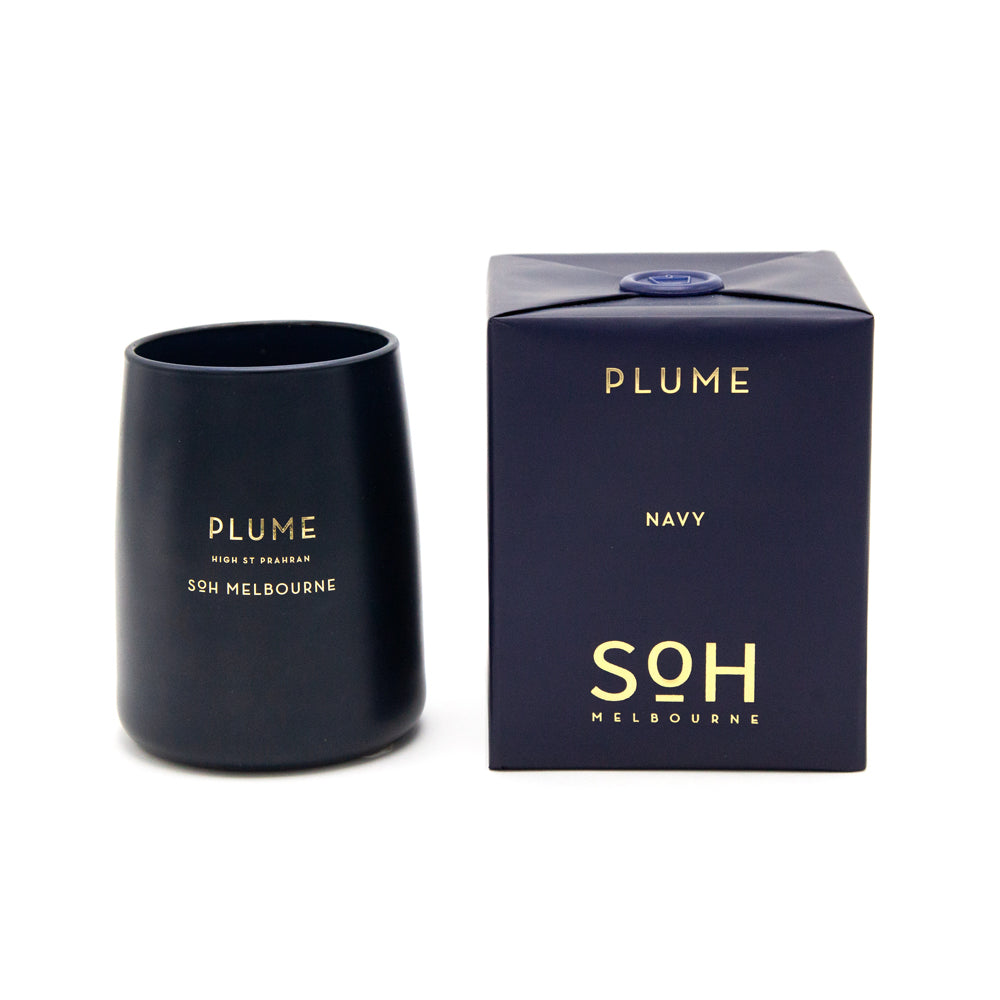 SoH Plume candle in navy vessel with packaging.
