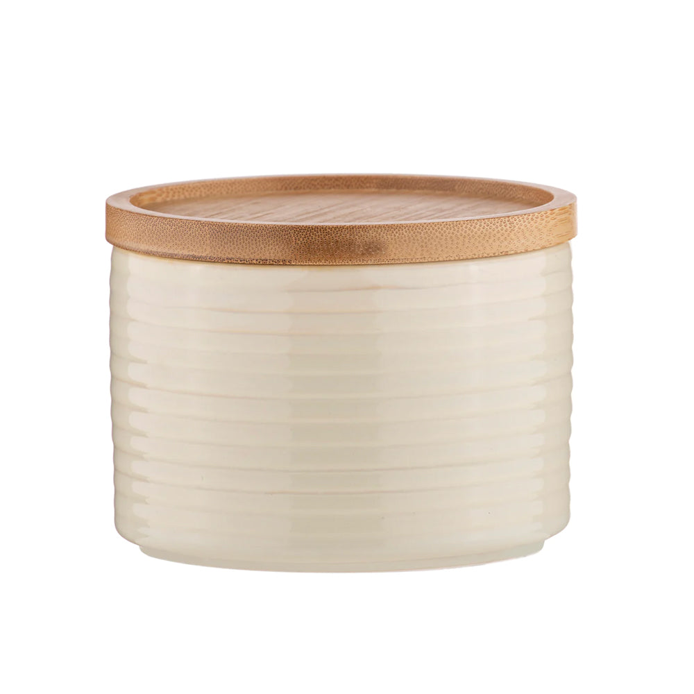 small ceramic kitchen canister with bamboo lid.